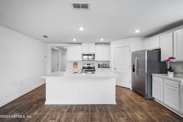 2035 Garrison Way, Green Cove Springs, FL 32043 - kitchen with white cabinetry, dark hardwood / wood-style flooring, stainless steel appliances, and an island with sink