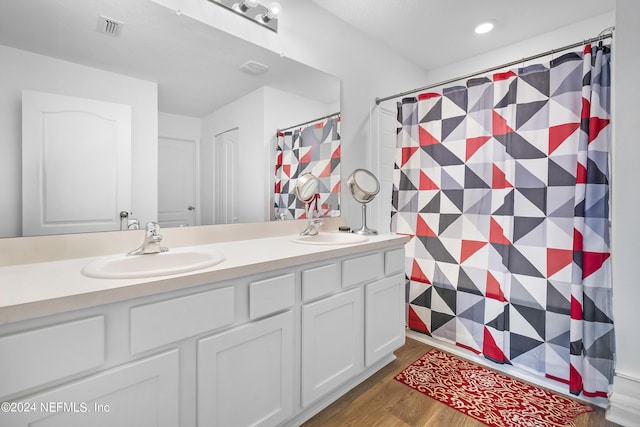 2035 Garrison Way, Green Cove Springs, FL 32043 - bathroom with wood-type flooring and vanity