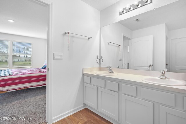 2035 Garrison Way, Green Cove Springs, FL 32043 - bathroom featuring vanity and hardwood / wood-style floors