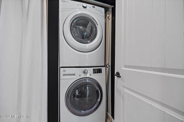 laundry room featuring stacked washer and dryer