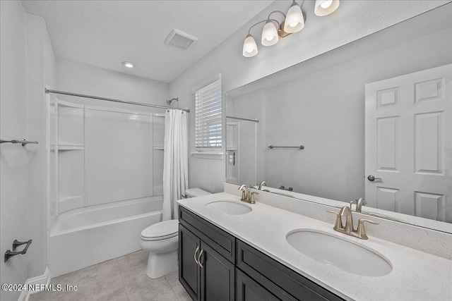 full bathroom with vanity, tile patterned floors, toilet, and shower / bath combo with shower curtain