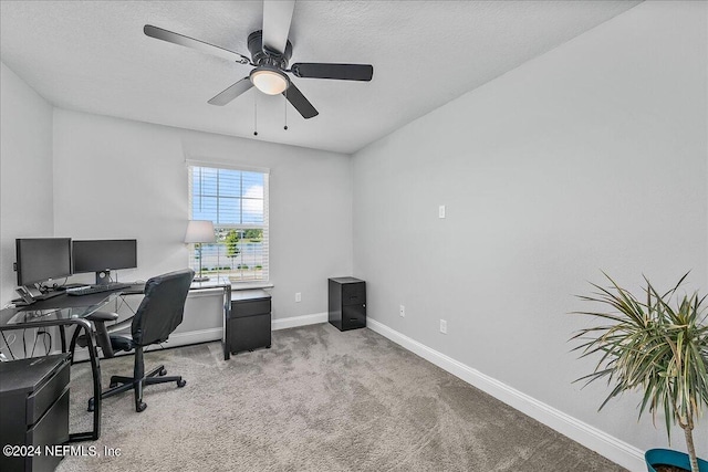 office area featuring ceiling fan, light colored carpet, and a textured ceiling