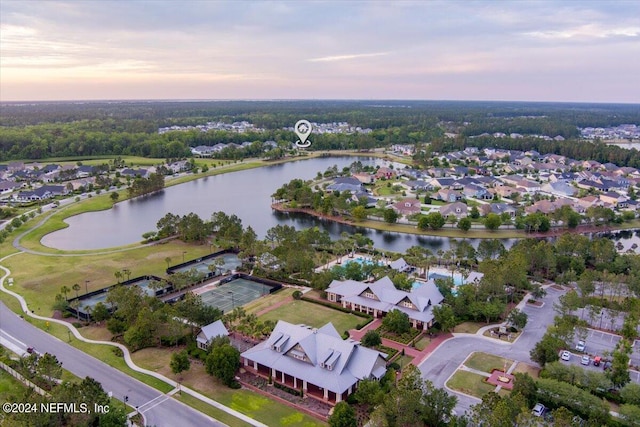 aerial view at dusk with a water view