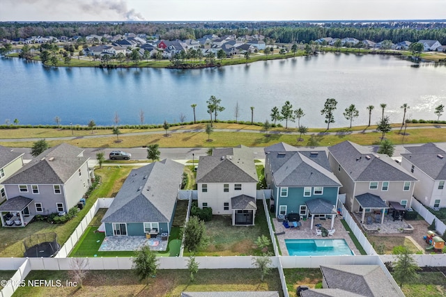 birds eye view of property with a water view