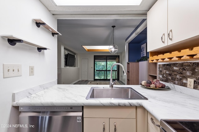 kitchen featuring pendant lighting, sink, wood-type flooring, and appliances with stainless steel finishes