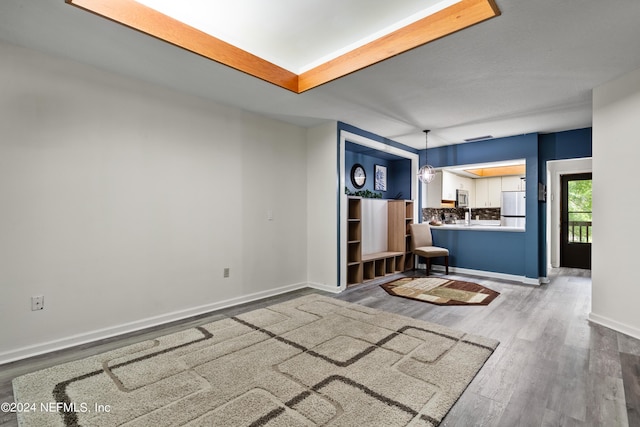 interior space featuring a chandelier and wood-type flooring