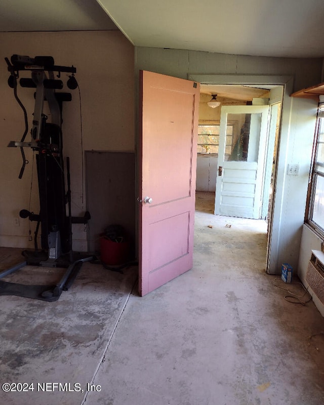 interior space with unfinished concrete floors