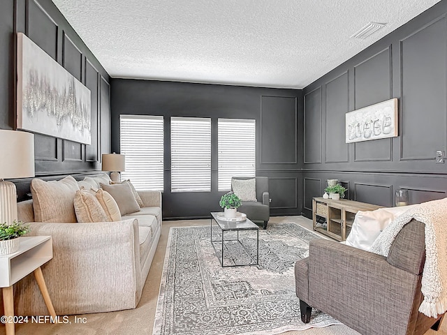 living room with a textured ceiling