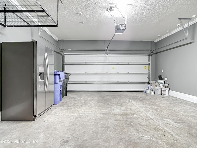 garage featuring stainless steel fridge with ice dispenser and a garage door opener