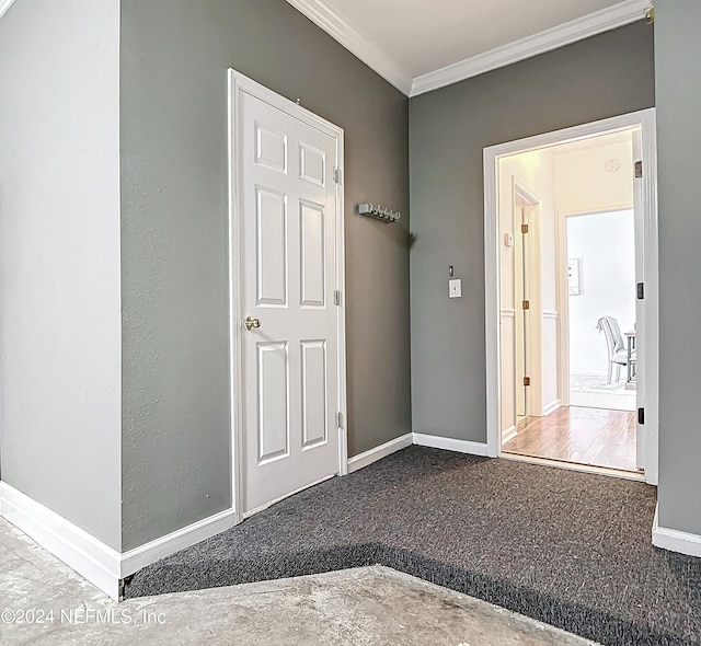 corridor with carpet flooring and crown molding