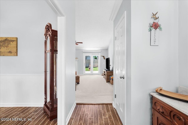 hall featuring french doors and dark hardwood / wood-style flooring