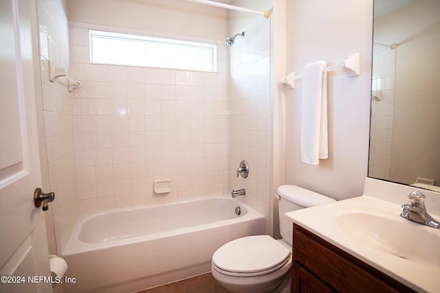 bathroom featuring tub / shower combination, vanity, and toilet