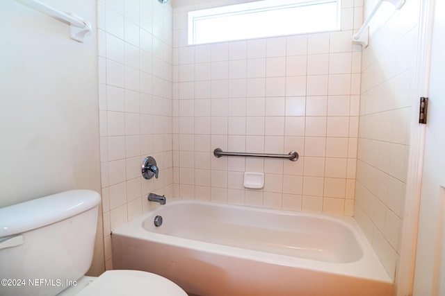 full bathroom with bathing tub / shower combination and toilet