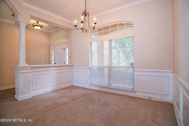 unfurnished room with a wainscoted wall, light carpet, crown molding, and ornate columns