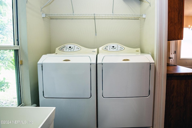 washroom featuring laundry area and washing machine and dryer