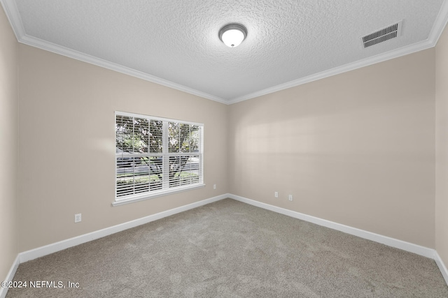 carpeted spare room with a textured ceiling and ornamental molding