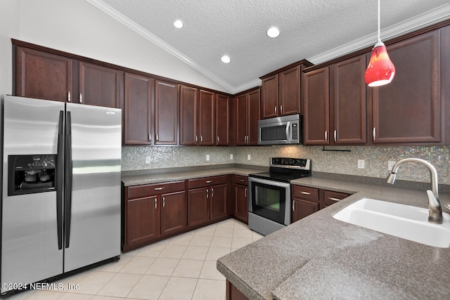 kitchen with tasteful backsplash, stainless steel appliances, sink, pendant lighting, and lofted ceiling