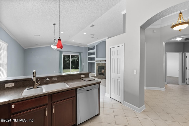 kitchen featuring dishwasher, built in shelves, pendant lighting, and sink