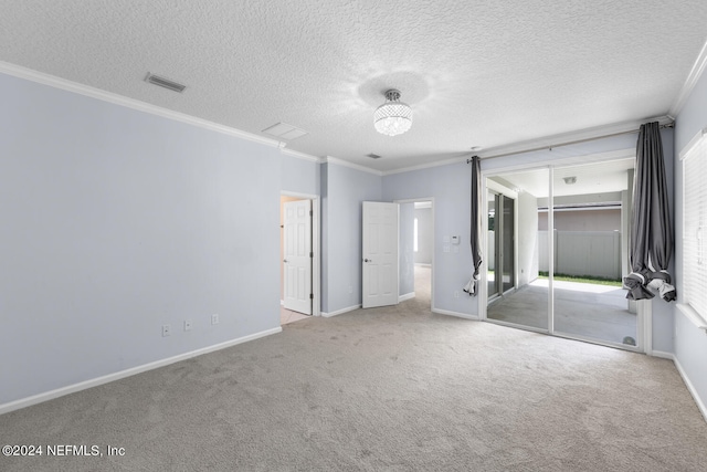 unfurnished bedroom featuring carpet flooring, a textured ceiling, a closet, and ornamental molding