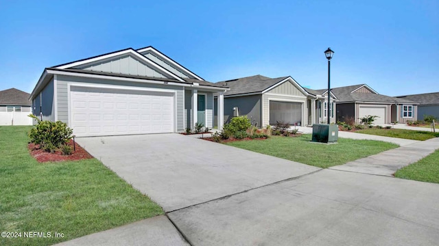 ranch-style home featuring a garage and a front lawn