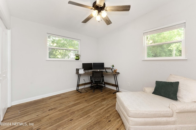 office featuring a wealth of natural light, hardwood / wood-style floors, ceiling fan, and vaulted ceiling