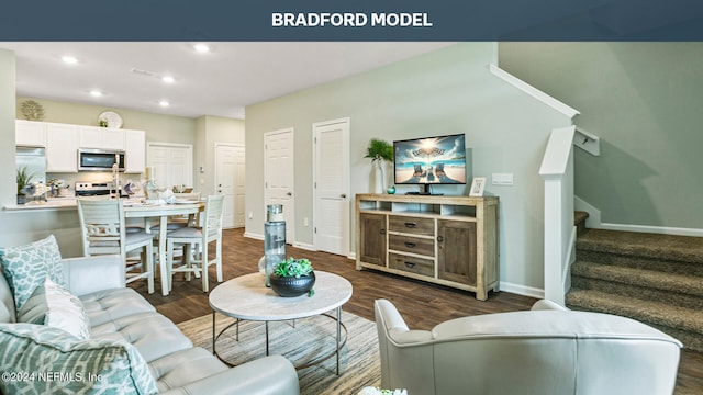 living area with recessed lighting, stairs, baseboards, and dark wood-style flooring