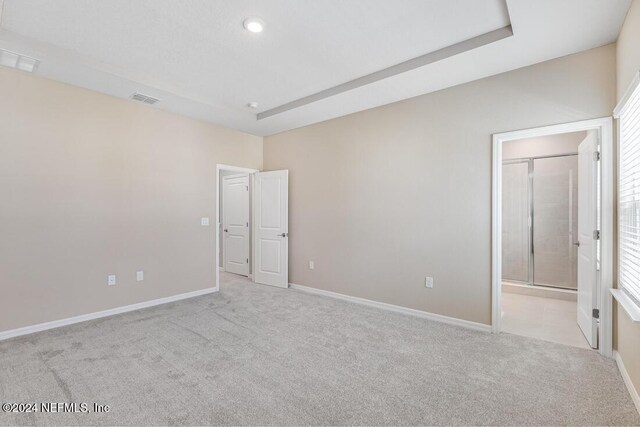 carpeted spare room featuring a healthy amount of sunlight