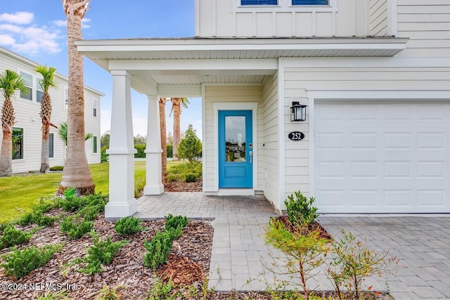 doorway to property featuring a garage