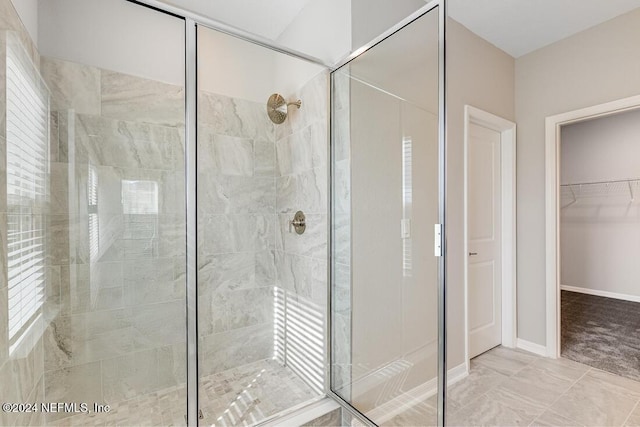 bathroom with tiled shower