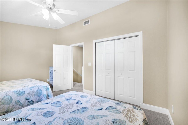 bedroom featuring carpet, ceiling fan, and a closet