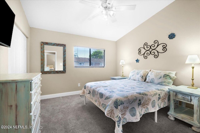 carpeted bedroom with ceiling fan and lofted ceiling