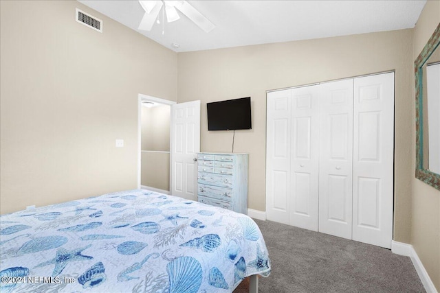 carpeted bedroom featuring a closet, ceiling fan, and lofted ceiling