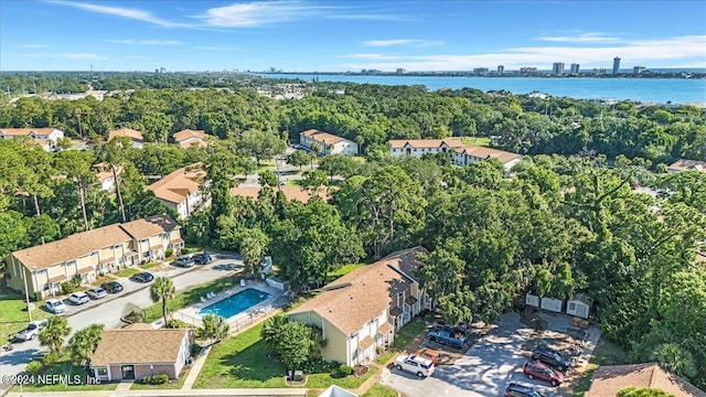 birds eye view of property with a water view