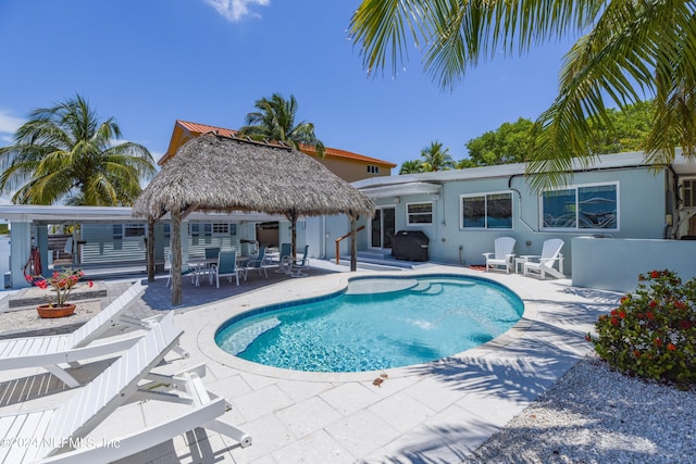 view of pool featuring area for grilling, a patio area, and a gazebo