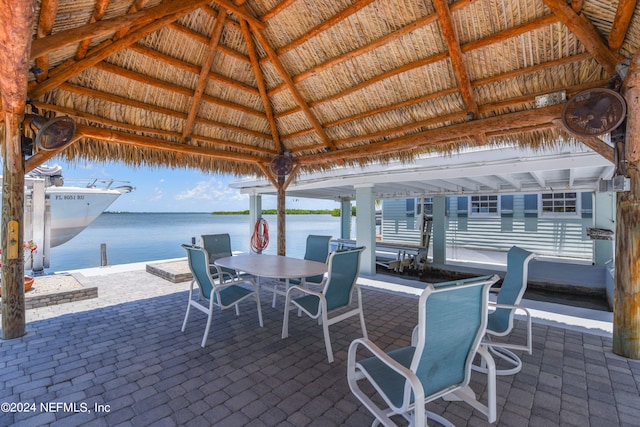 view of patio / terrace with a gazebo and a water view