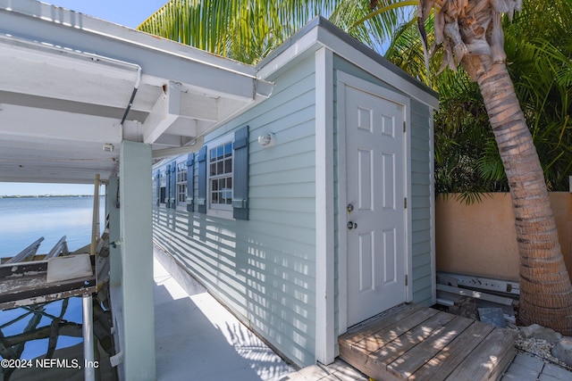 view of outbuilding featuring a water view