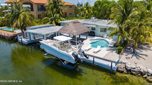 exterior space featuring a water view and a patio