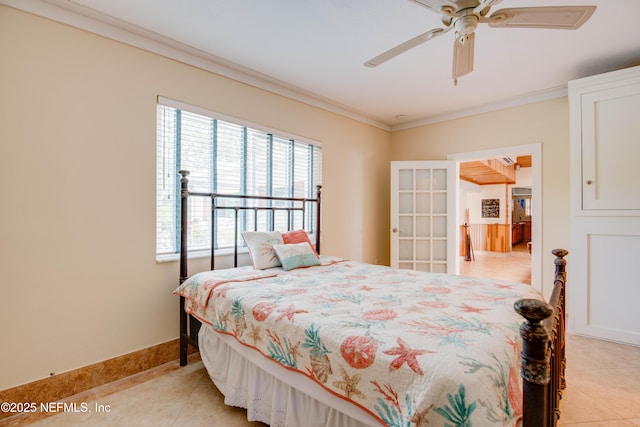 bedroom featuring ceiling fan, crown molding, and light tile patterned flooring