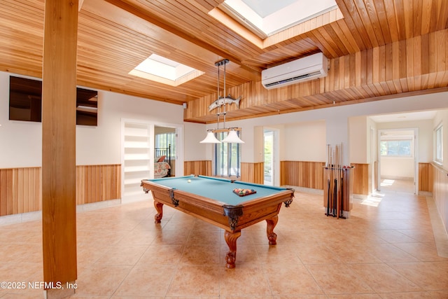 playroom featuring wood ceiling, a skylight, an AC wall unit, light tile patterned floors, and pool table