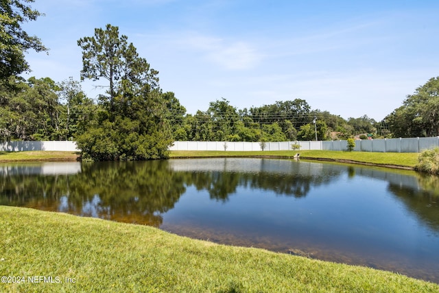 view of water feature with fence