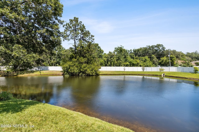 view of water feature featuring fence