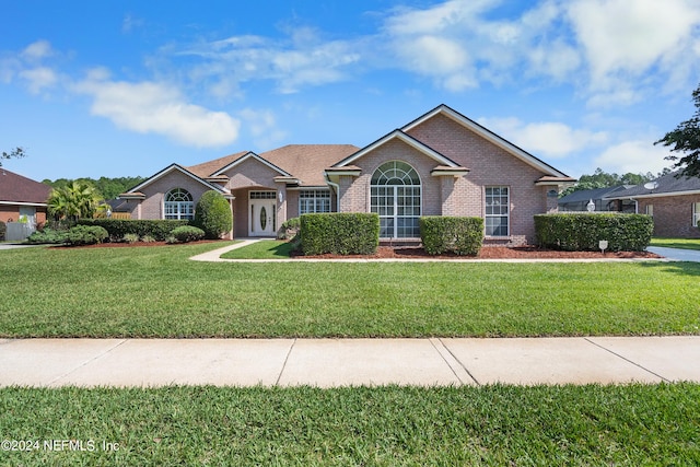 ranch-style house with a front yard