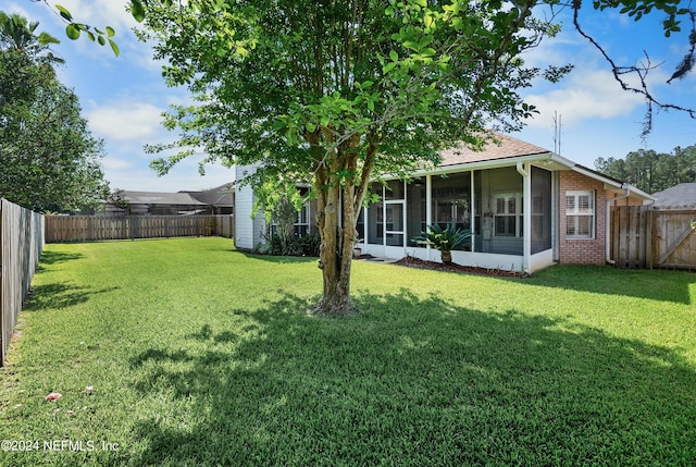 view of yard with a sunroom