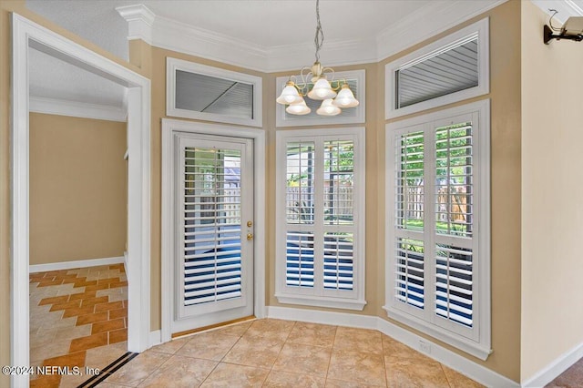 doorway with ornamental molding and an inviting chandelier