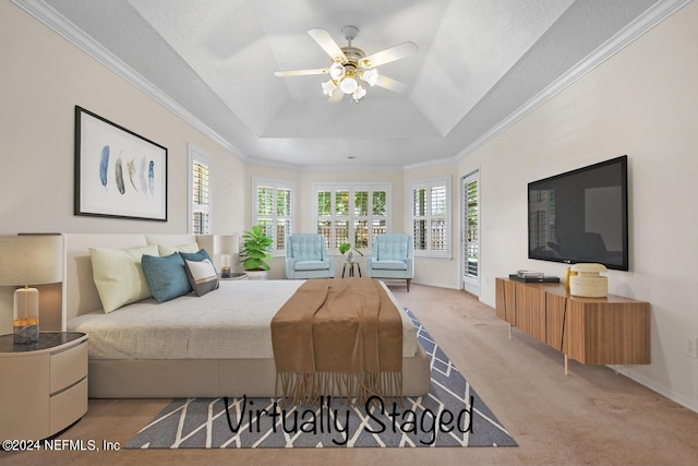 carpeted bedroom featuring ornamental molding, a textured ceiling, access to outside, a raised ceiling, and ceiling fan