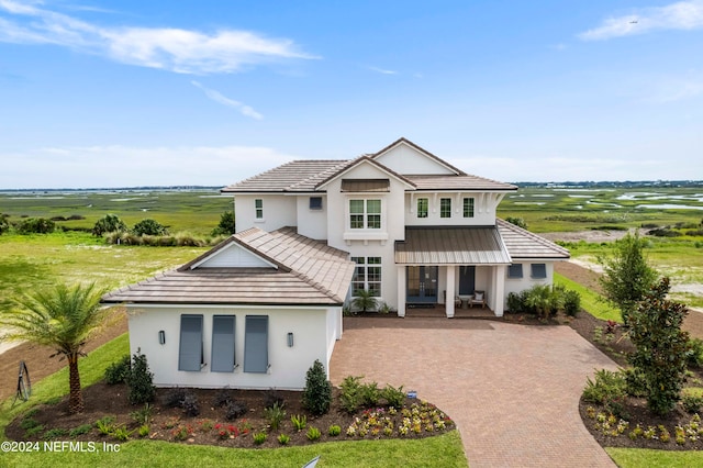 view of front of house with a rural view