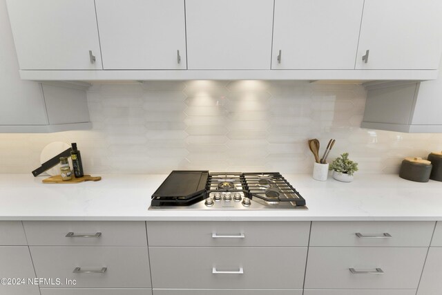 kitchen featuring tasteful backsplash and stainless steel gas stovetop