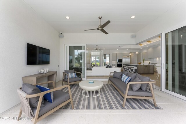 living room with sink and ceiling fan