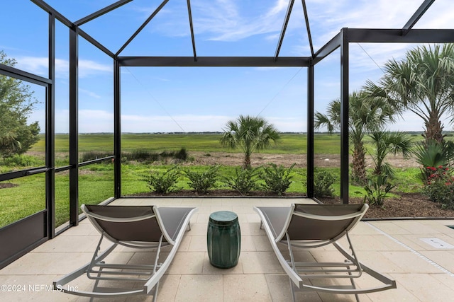 sunroom featuring a rural view