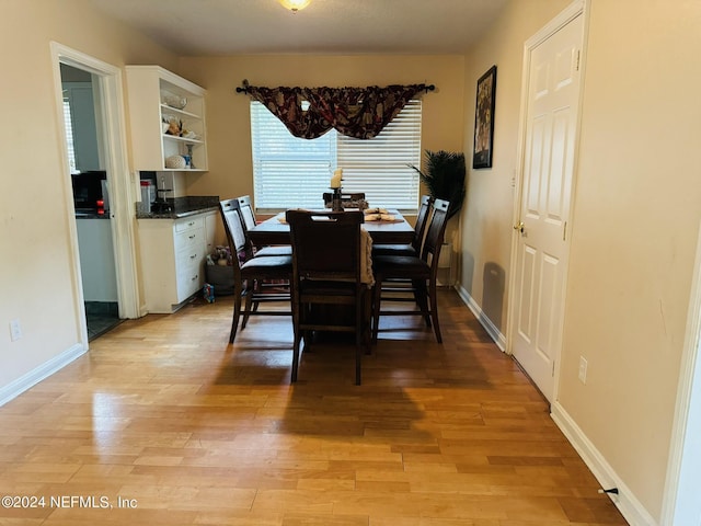 dining space featuring light wood-type flooring